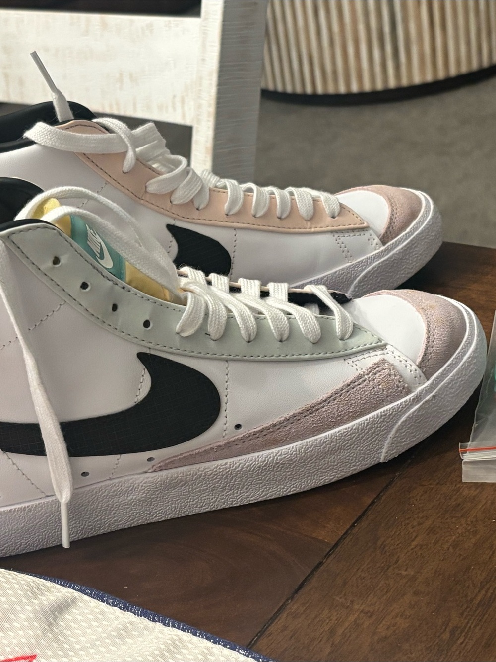 Nike Mid-Top Sneakers in White with Black Swoosh and Pastel Accents